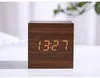 A wooden cube digital clock displaying the time. Produktbild-Vorschau