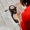 A person is using a Kärcher mattress vacuum on a quilted mattress. Produktbild-Vorschau