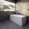 A modern bathroom with a large window overlooking greenery, featuring a white rectangular bathtub with a grey tiled wall and floor. Produktbild-Vorschau