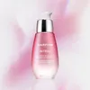 A bottle of Darphin Intral Inner Youth Rescue Serum against a soft pink and white abstract background. Produktbild-Vorschau