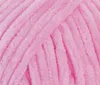 A close-up, textured view of pink yarn. Náhľad obrázku produktu