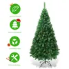 A green artificial Christmas tree with a metal stand, shown on a white background with informational icons on the left. Produktbild-Vorschau