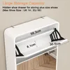 A white shoe cabinet with dimensions indicated by text overlays. Podgląd zdjęcia produktu