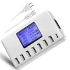 A white USB charging station with multiple ports and an LCD screen, shown with its power cables. Produktbild-Vorschau