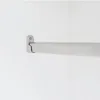 A close-up view of a closet rod bracket and rod, mounted on a white wall. Produktbild-Vorschau