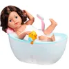 A doll is taking a bath in a toy bathtub with bubbles and a rubber duck. Produktbild-Vorschau