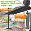 A patio umbrella is set up next to a swimming pool with people relaxing and playing. Produktbild-Vorschau