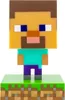 A Minecraft Steve character figurine standing on a grass and dirt block base. Produktbild-Vorschau