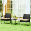 A three-piece outdoor furniture set on a green lawn in front of a large glass door. Podgląd zdjęcia produktu