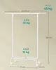 A white garment rack with dimensions and weight capacity indicated by text and arrows. Produktbild-Vorschau