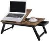 A laptop table with a laptop and a cup of coffee on it, set against a white background.