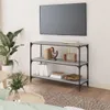 A living room scene with a TV mounted on the wall above a gray bookshelf. Podgląd zdjęcia produktu