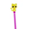 A close-up of a yellow glittery cat figurine on top of a pink pencil. Podgląd zdjęcia produktu