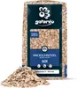 A bag of wood chips with a pile of wood chips in front of it. Produktbild-Vorschau