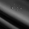 A close-up view of black fabric with water droplets on it, suggesting a waterproof feature. Anteprima dell’immagine prodotto
