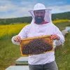 Dimitrios Kontis hält Bienenwabe mit Bienen dran Produktbild-Vorschau