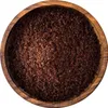 A top-down view of ground sumac spice in a wooden bowl. Produktbild-Vorschau
