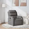 A dark gray fabric massage chair is shown in a room with a floor lamp and artwork on the wall. Náhľad obrázku produktu