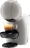 A close-up side view of a gray Dolce Gusto coffee machine with a cup of coffee. Náhled obrázku produktu