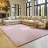 A spacious living room with a large sectional sofa and a pink rug. Produktbild-Vorschau