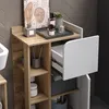 A close-up view of a bathroom cabinet with shelves and a drawer, showcasing toiletries and decor. Náhled obrázku produktu