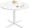 A round white table with a floral arrangement and a book on it. Náhled obrázku produktu
