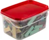 A clear plastic container with a red lid, filled with various wooden blocks of different colors and shapes. Produktbild-Vorschau