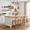 A modern kitchen island with bar stools and pendant lights. Produktbild-Vorschau