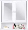 A white bathroom cabinet with mirrored doors and a shelf below displaying various toiletries. Anteprima dell’immagine prodotto