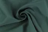 A close-up shot of green fabric with a swirl pattern. Produktbild-Vorschau