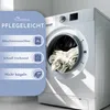 A washing machine with laundry inside, next to a panel listing product care instructions. Produktbild-Vorschau