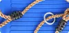 A close-up view of a blue swing seat with ropes and fasteners. Anteprima dell’immagine prodotto