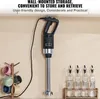 A black and silver immersion blender is mounted on a wall, with a rack of colorful mugs to the left and glass bottles to the right. Anteprima dell’immagine prodotto