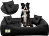 A border collie dog sitting on a black dog bed with two small pillows. Produktbild-Vorschau