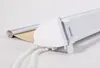 A close-up view of a white roller blind mechanism with a silver roller and tan fabric partially unrolled. Produktbild-Vorschau