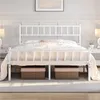 A white metal bed frame with a headboard and footboard, dressed with bedding and pillows. Two storage baskets are placed underneath the bed. Produktbild-Vorschau