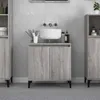 A bathroom vanity with a sink and cabinets. Produktbild-Vorschau