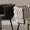 Close-up view of two chairs with textured upholstery and black metal legs. Produktbild-Vorschau
