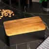 A bread box with a wooden lid sits on a black marble countertop, with peanuts scattered nearby. Produktbild-Vorschau