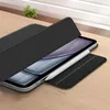 A tablet with a black case and a stylus on a wooden surface. Anteprima dell’immagine prodotto