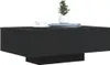 A black coffee table with a plant and a book on top. Produktbild-Vorschau