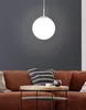 A modern living room scene with a brown sofa, a coffee table, and a pendant light. Náhľad obrázku produktu