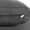 A close-up view of a dark gray fabric cushion with a zipper. Produktbild-Vorschau