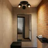 A hallway with a mirror, a bench, and a brick wall. Podgląd zdjęcia produktu