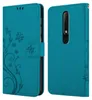 A teal flip case for a smartphone is shown from two angles, open and closed. Náhled obrázku produktu