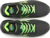 A top-down view of two black and green athletic shoes. Voir les images du produit
