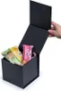 A black gift box with the lid open, containing three muesli bars. Náhled obrázku produktu