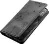 A black flip phone case with a dandelion design is shown on a white background. Produktbild-Vorschau