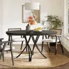 A round dining table set with chairs in a well-lit room. Anteprima dell’immagine prodotto