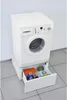 A white washing machine pedestal with an open drawer containing laundry supplies. Anteprima dell’immagine prodotto